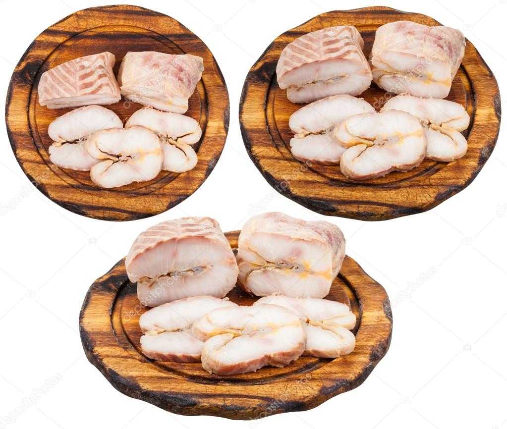 set of boards with hot smoked sturgeon isolated