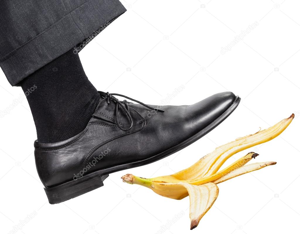 leg in the right black shoe slips on a banana peel