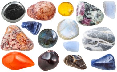 many tumbled ornamental gem stones isolated clipart