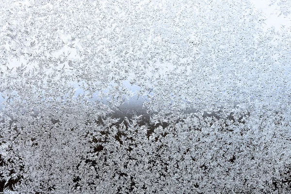 Heladas en el cristal de la ventana en la noche de invierno —  Fotos de Stock