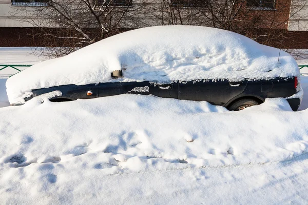 Side view of black car covered with snow — Stock Photo, Image