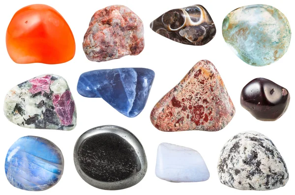 Various tumbled ornamental gem stones isolated — Stockfoto