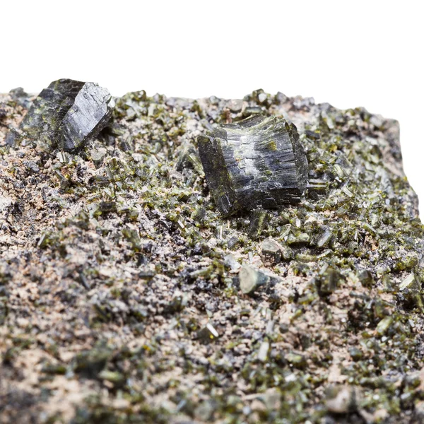 druse of green epidote crystals close up on rock