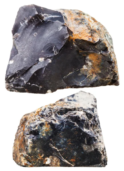 Two pieces of black flint (chert) rock isolated — Stock fotografie
