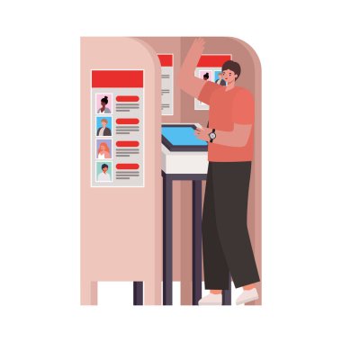 Oy verme kabininde kahverengi saçlı ve somon rengi gömlekli bir adam var.