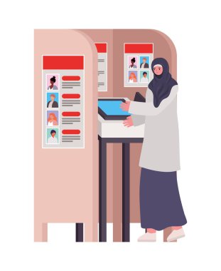 Oy kabininde tesettürlü ve gri elbiseli kadın.