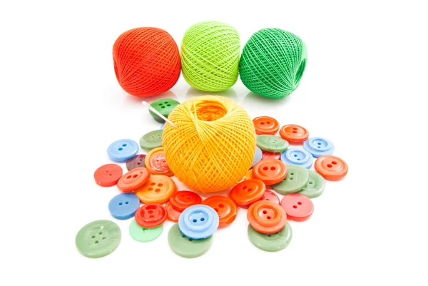 Buttons, needle and tangles of thread — Stock Photo, Image