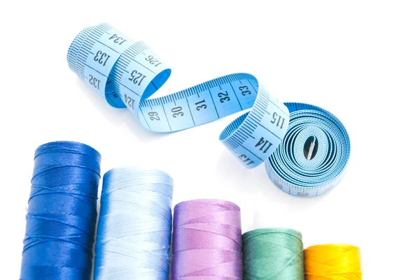 Colored threads and blue meter — Stock Photo, Image