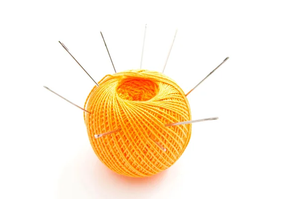 Yellow ball of thread with needles — Stock Photo, Image