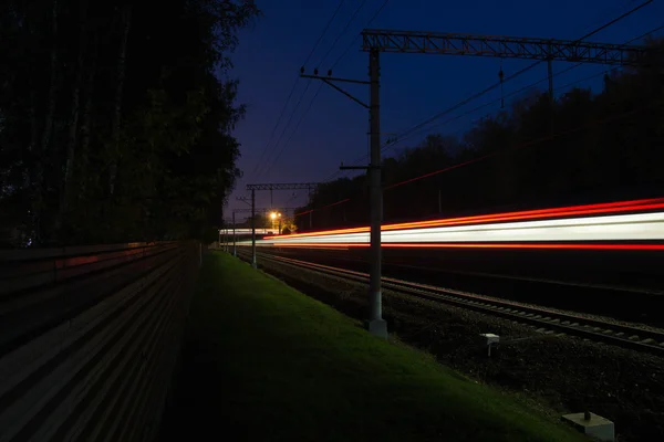 Movement on railroad tracks outside the city Royalty Free Stock Images