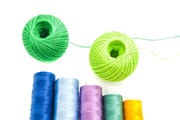 Spools of threads and two balls of yarn — Stock Photo, Image