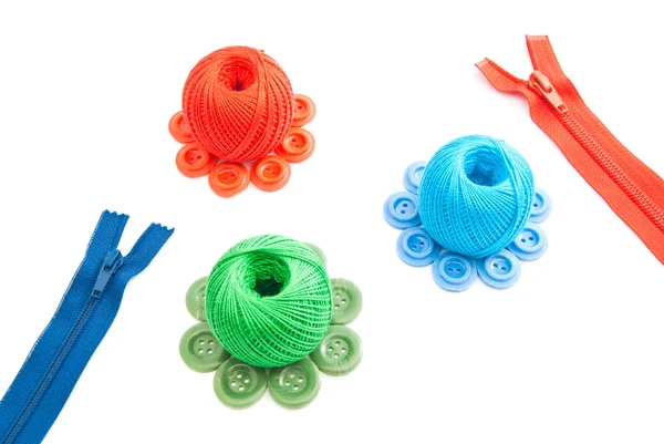 Different spools of thread, zipper and buttons — Stock Photo, Image