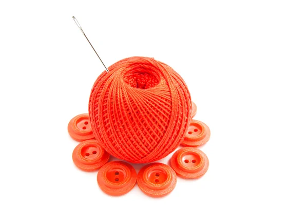 Red buttons, thread and needle — Stock Photo, Image