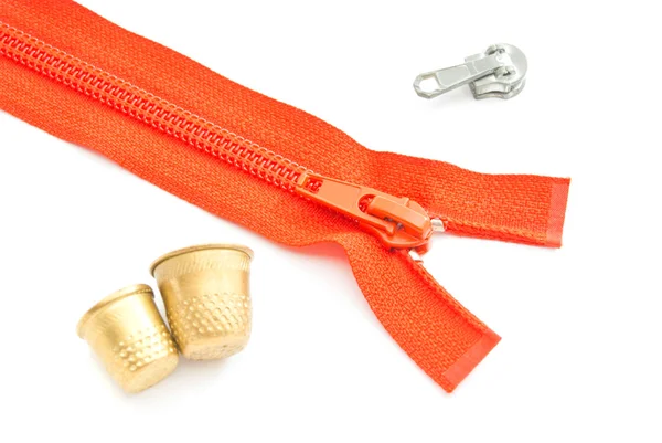 Red zipper and thimbles — Stock Photo, Image