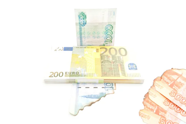 Euros and burnt rubles — Stock Photo, Image