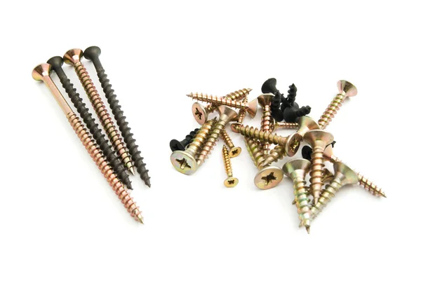 Heaps of screws on white — Stock Photo, Image