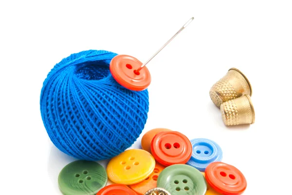 Plastic buttons, thimbles and thread — Stock Photo, Image