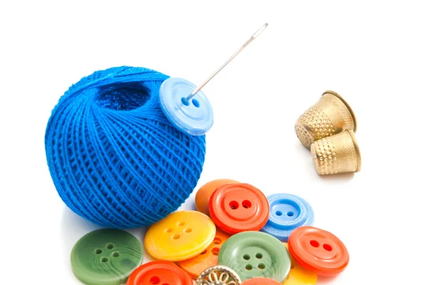 Colored buttons, thimbles and thread — Stock Photo, Image