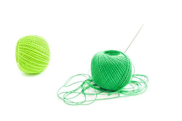 Spools of green thread and needle — Stock Photo, Image