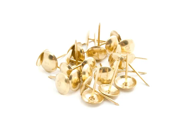 Heap of golden pins on white — Stock Photo, Image