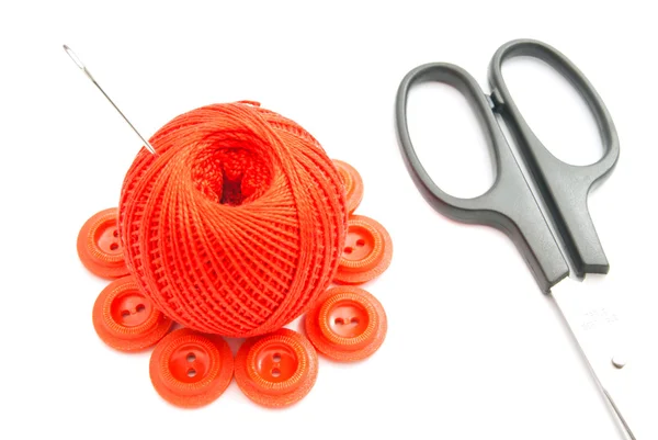 Red buttons, needle, scissors and thread — Stock Photo, Image