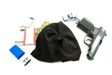 Silah, maske, banknot ve polis arabaları