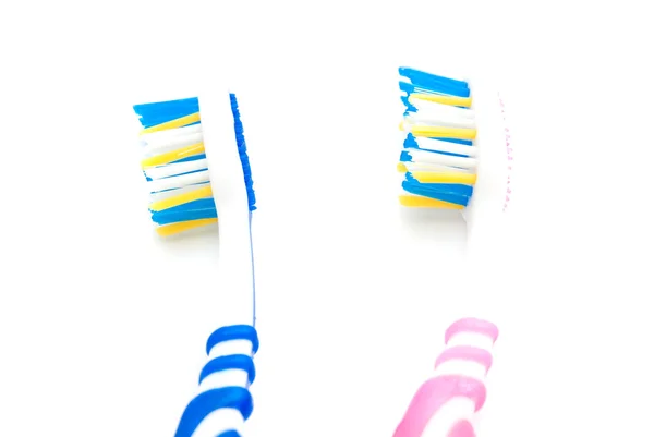 Blue and pink toothbrushes — Stock Photo, Image
