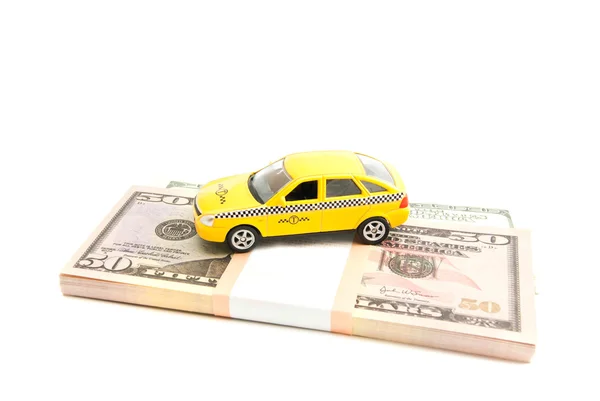 Taxi car and dollars on white — Stock Photo, Image