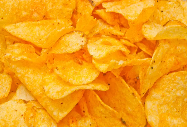 Viele leckere Kartoffelchips — Stockfoto