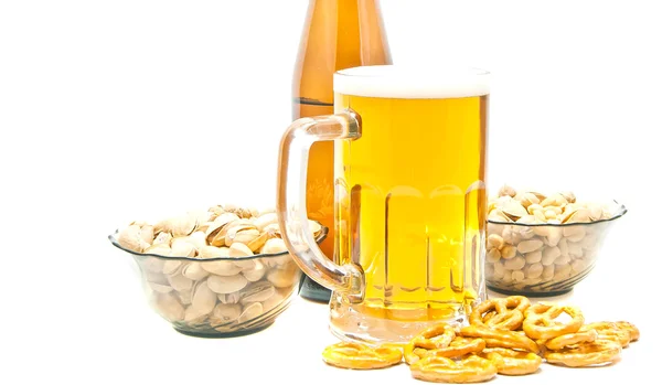 Different nuts, pretzels and beer on white — Stock Photo, Image