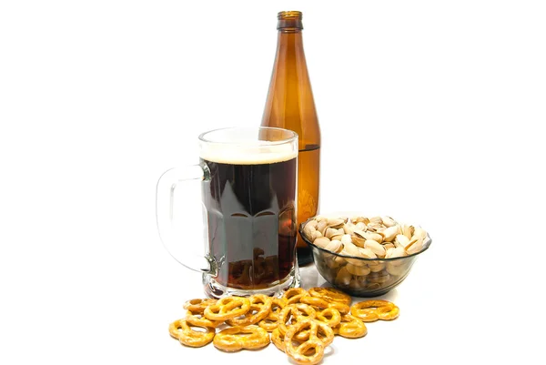 Pretzels and pistachios with beer closeup — Stock Photo, Image