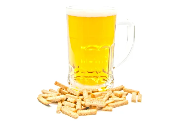 Glass of beer and crisps on white — Stock Photo, Image