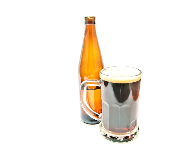 Mug of dark beer and bottle — Stock Photo, Image