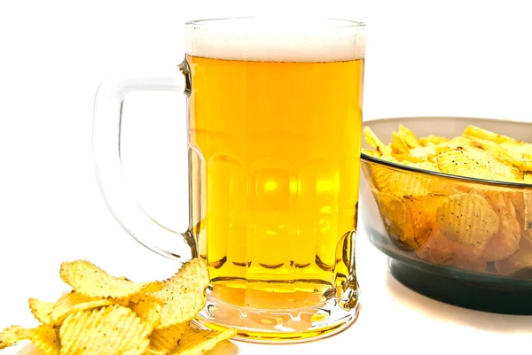 Beer in glass and crispy chips — Stock Photo, Image
