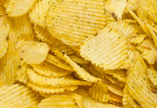 Heap of tasty corrugated potato chips — Stock Photo, Image