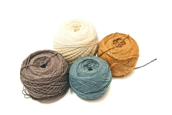 Four balls of yarn on white — Stock Photo, Image