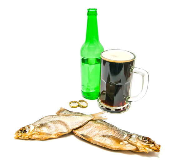salted fishes and glass of beer closeup