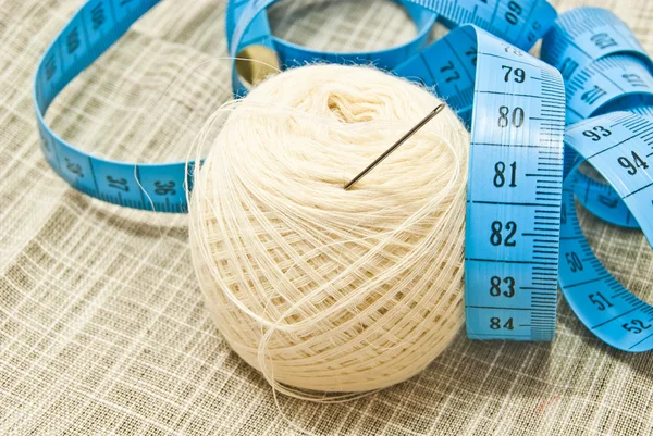 Yarn with needle and blue meter closeup — Stock Photo, Image