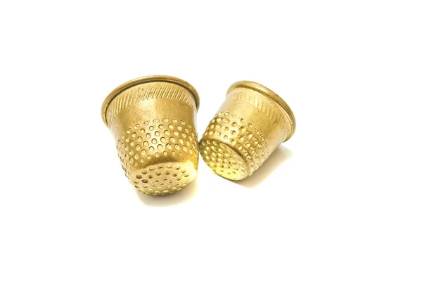 Two golden thimbles on white — Stock Photo, Image