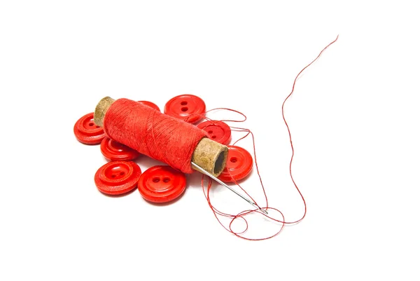 Thread and red buttons — Stock Photo, Image