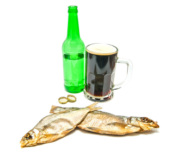 salted fishes and glass of beer on white
