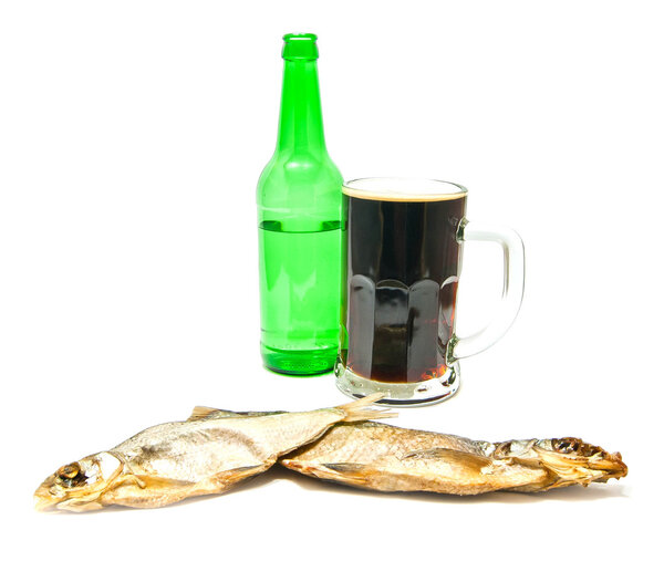 glass of dark beer and salted fishes