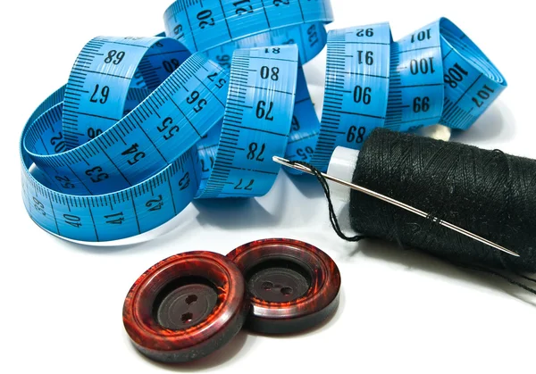 Spool of thread, meter and buttons — Stock Photo, Image