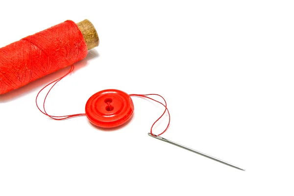 Spool of thread, button and needle — Stock Photo, Image