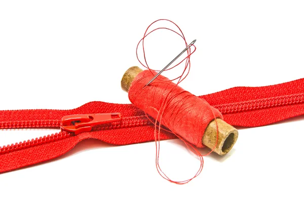 Zipper and spool of thread — Stock Photo, Image