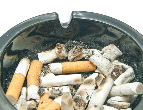 Butts in black ashtray on white — Stock Photo, Image