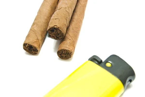 Three cigars and yellow lighter — Stock Photo, Image