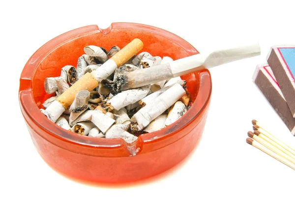 Butts, matches and cigarette on white — Stock Photo, Image