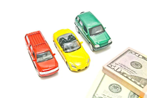 Three different cars and dollar notes — Stock Photo, Image