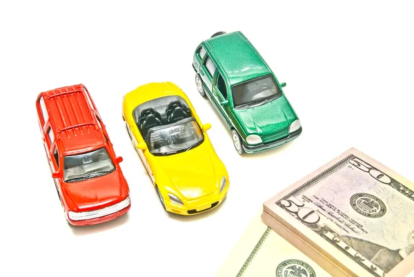 Three cars and dollar notes — Stock Photo, Image